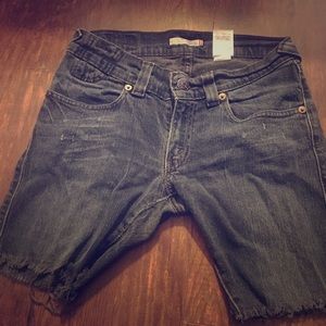 Levi’s dark denim shorts, distressed hem